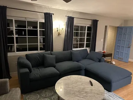 a living room with furniture and windows