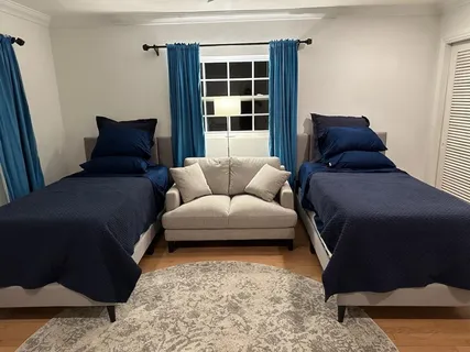 a living room with a couch and a large window