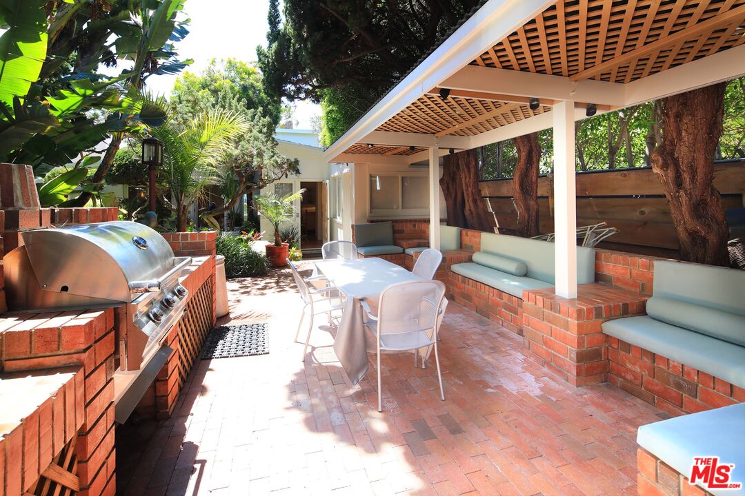 31008 Broad Beach Road Malibu, CA 90265 - Photo 33 of 40 a view of a patio with couches table and chairs and potted plants