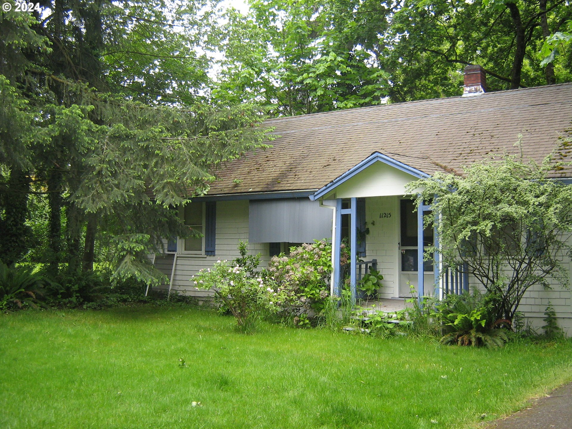 11215 Southwest Hall Boulevard Portland, OR 97223 - Photo 8 of 10 a house with a tree in front of it