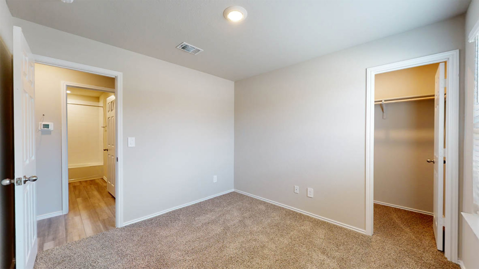 148 McNamara Court Jarrell, TX 76537 - Photo 15 of 22 Unfurnished bedroom with a spacious closet and light colored carpet