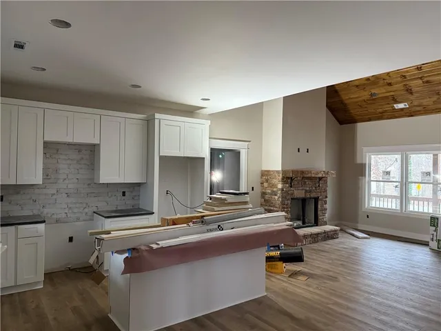 a kitchen with a sink cabinets and window