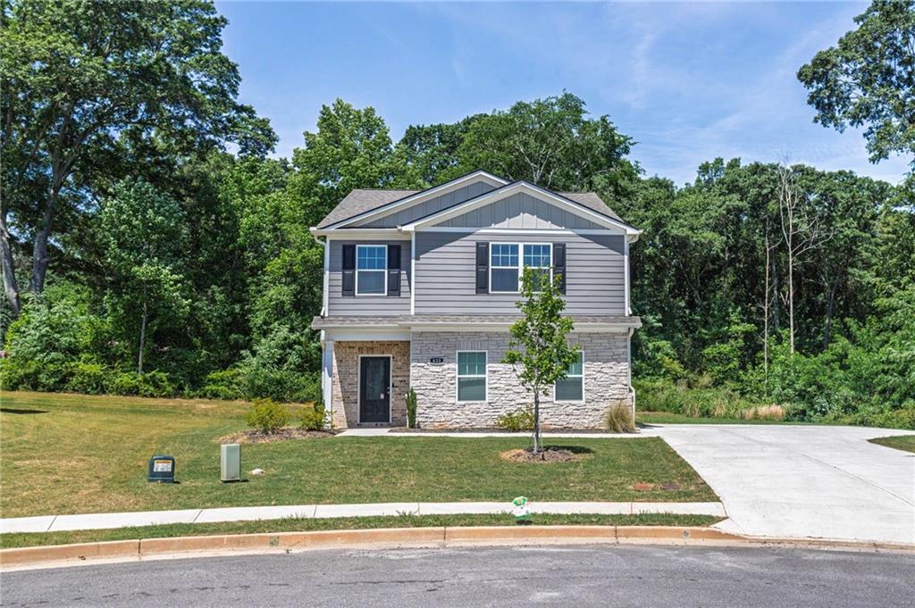 635 Meadows Farm Way Monroe, GA 30655 - Photo 6 of 36 a front view of a house with a yard