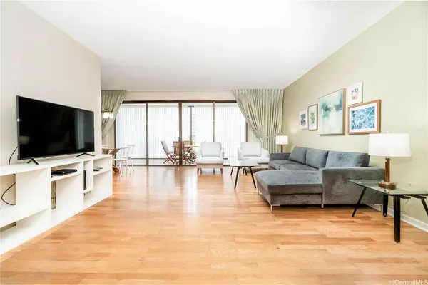 a living room with furniture and a flat screen tv