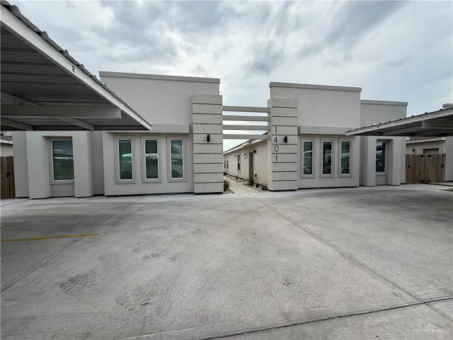 a view of a house with a barbeque