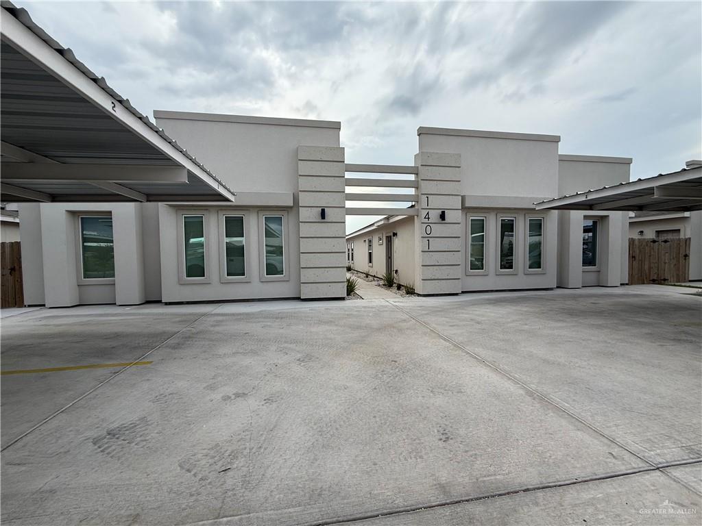 a view of a house with a barbeque
