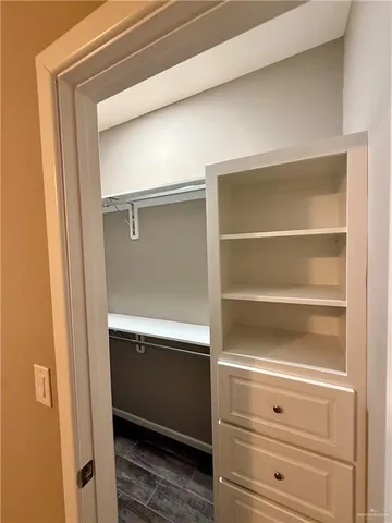 a view of an empty walk in closet