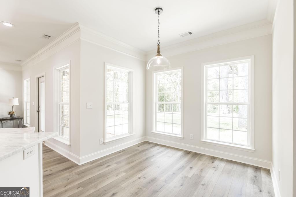 224 Otters Rdg Drive Kathleen, GA 31047 - Photo 12 of 31 a view of an empty room with wooden floor and a window