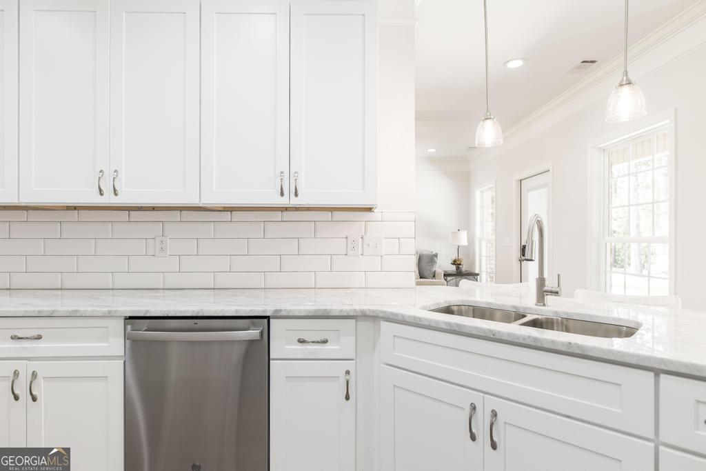 224 Otters Rdg Drive Kathleen, GA 31047 - Photo 14 of 31 a kitchen with granite countertop white cabinets and a sink