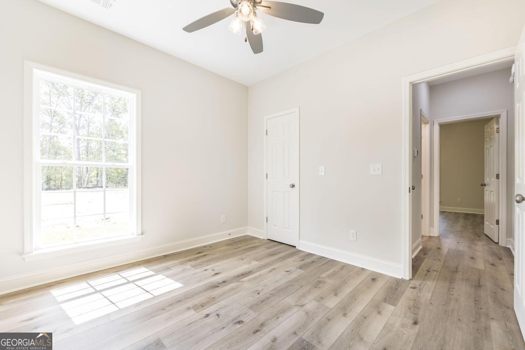 224 Otters Rdg Drive Kathleen, GA 31047 - Photo 24 of 31 a view of an empty room with wooden floor and a window