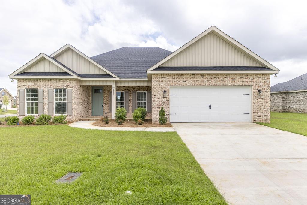 224 Otters Rdg Drive Kathleen, GA 31047 - Photo 3 of 31 a view of a house with a yard and garage