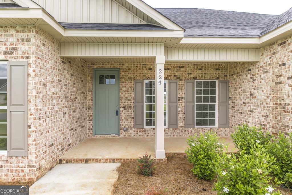 224 Otters Rdg Drive Kathleen, GA 31047 - Photo 4 of 31 front view of a brick house with a large door