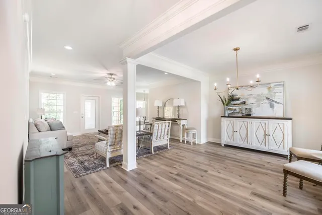 a view of a living room and dining room