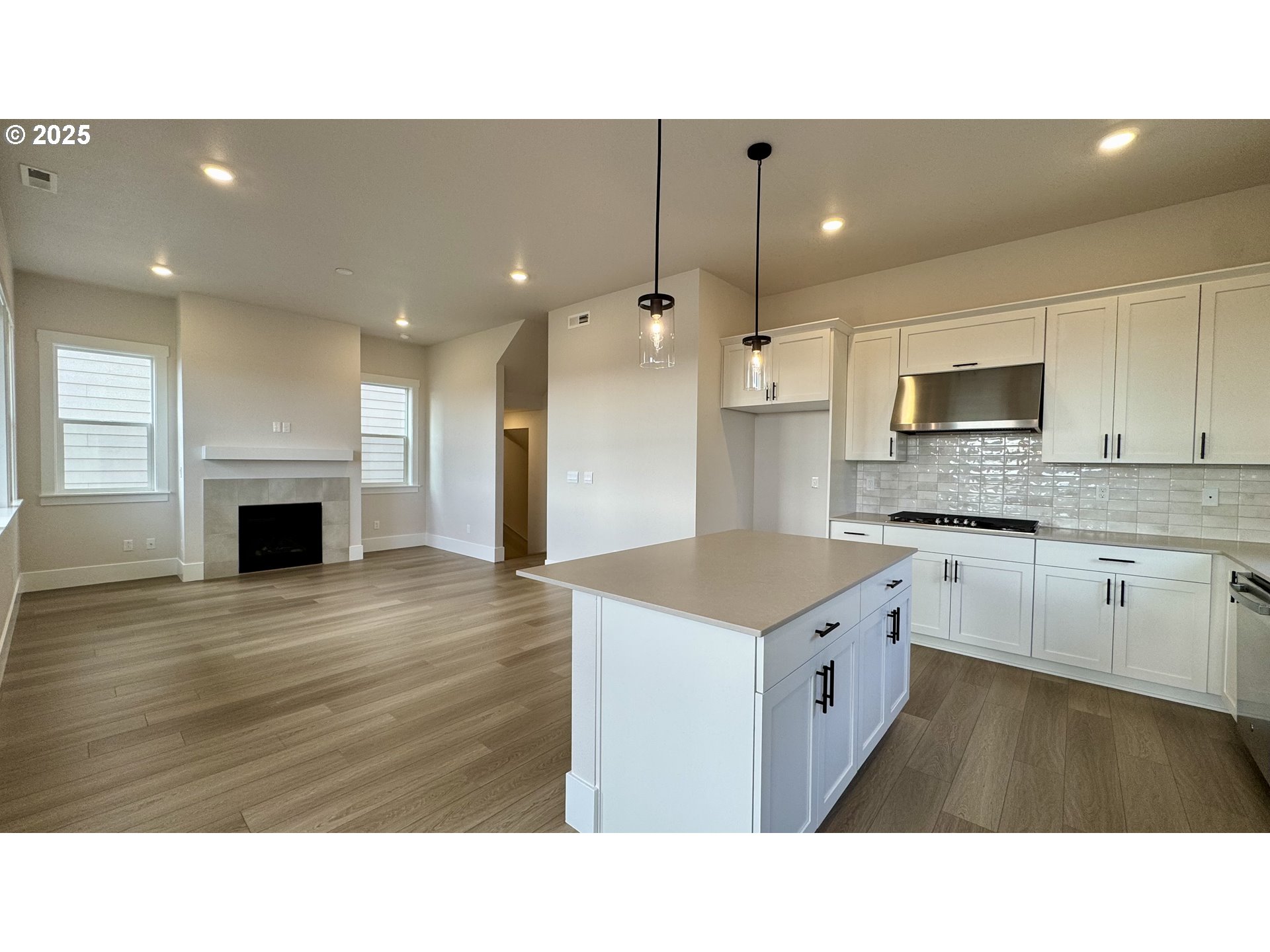 17614 Southwest Watchman Lane Beaverton, OR 97007 - Photo 13 of 36 a kitchen with a sink a microwave and cabinets