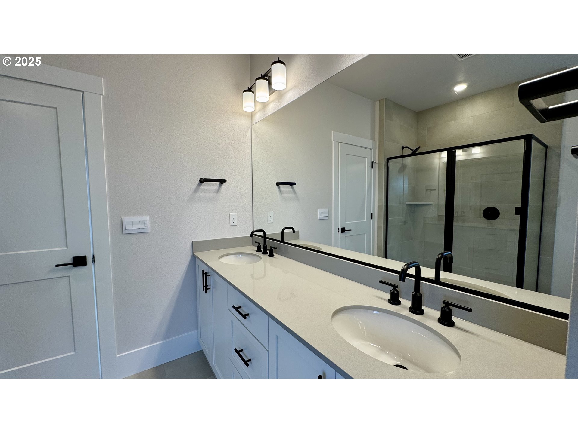 17614 Southwest Watchman Lane Beaverton, OR 97007 - Photo 25 of 36 a bathroom with a sink double vanity granite tub shower and a mirror