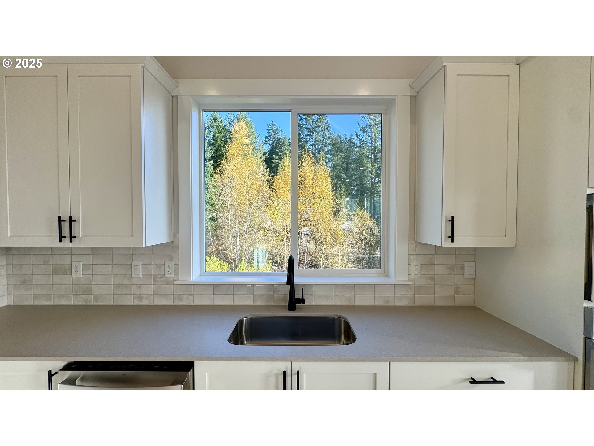 17614 Southwest Watchman Lane Beaverton, OR 97007 - Photo 34 of 36 a kitchen with a sink window and cabinets