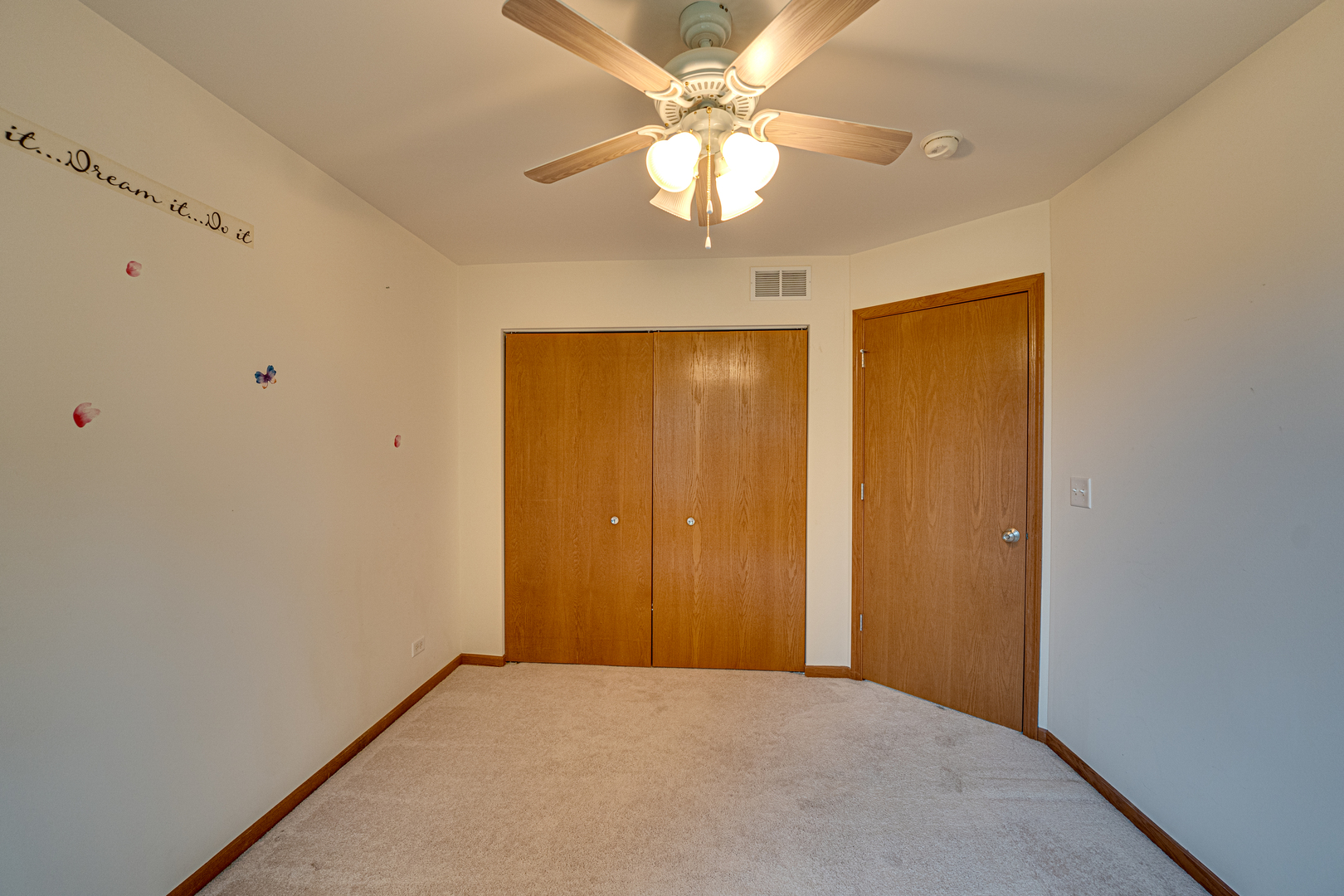 3904 Preston Drive Yorkville, IL 60560 - Photo 17 of 25 an empty room with a chandelier fan and closet area