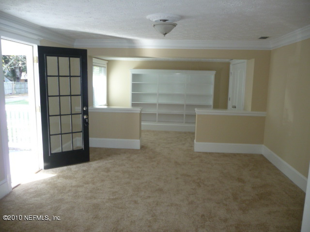10648 Scott Mill Road Jacksonville, FL 32223 - Photo 3 of 8 dining room to living room