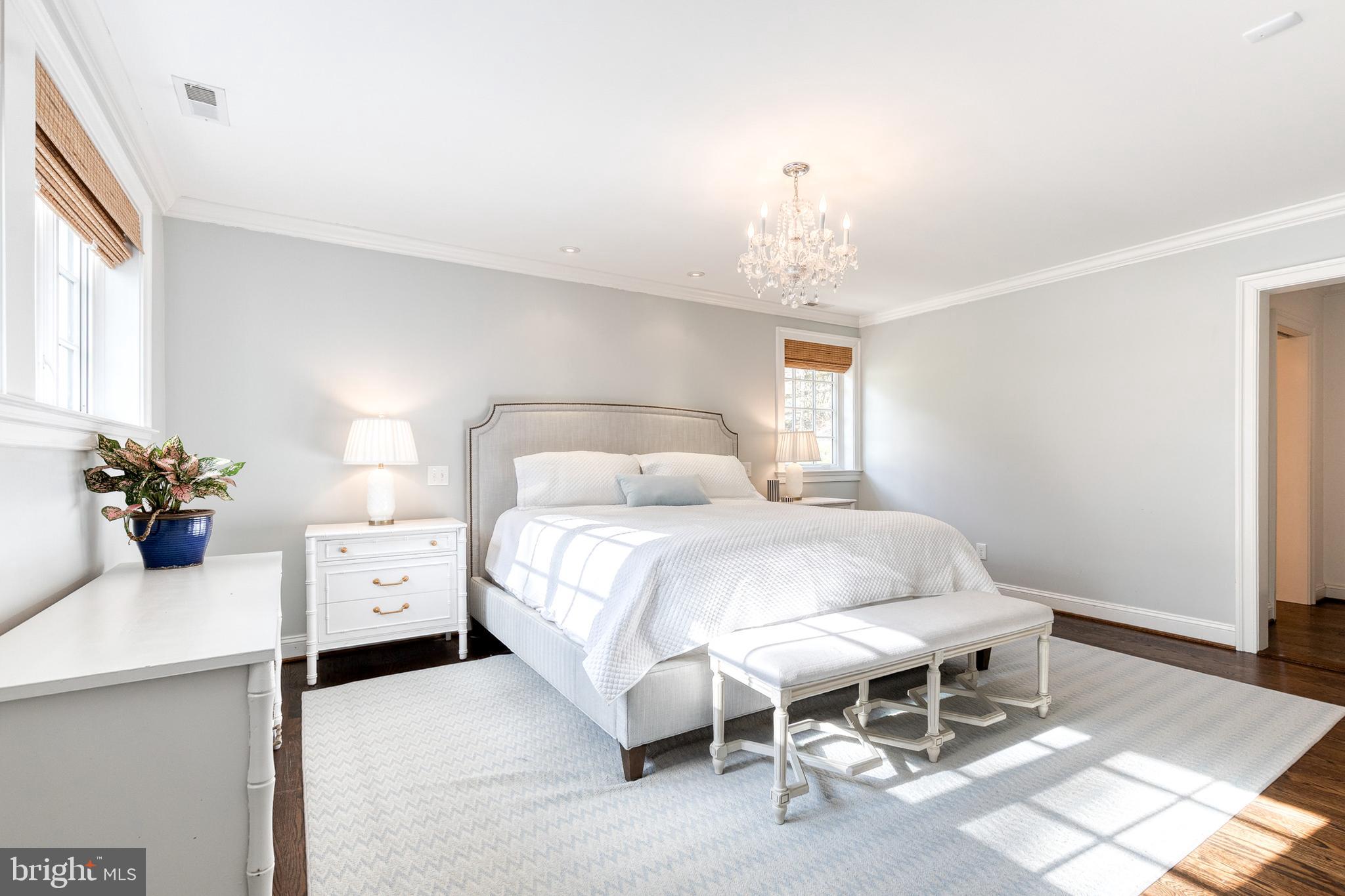 1808 Circle Road Baltimore, MD 21204 - Photo 32 of 64 a bedroom with a bed and a chandelier