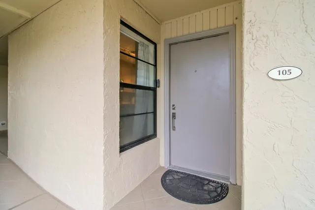 a kitchen with granite countertop a stove and a refrigerator