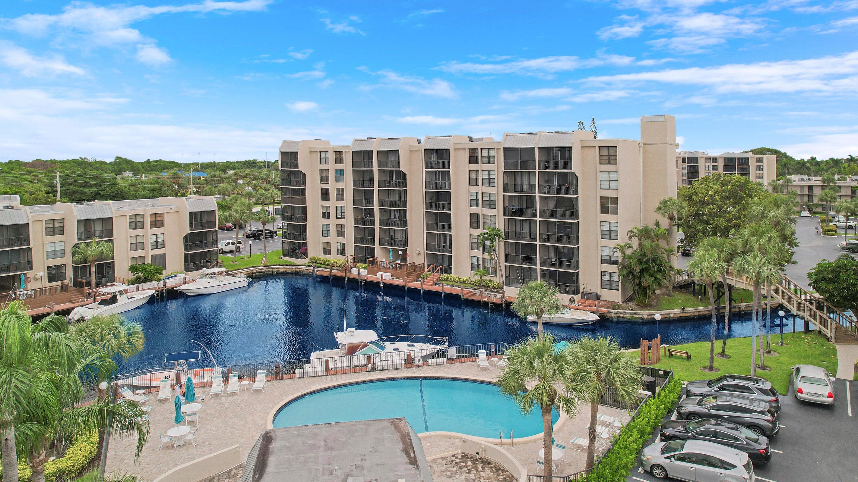 9 Royal Palm Way, Unit 105 Boca Raton, FL 33432 - Photo 21 of 26 a view of a patio with couches table and chairs and potted plants