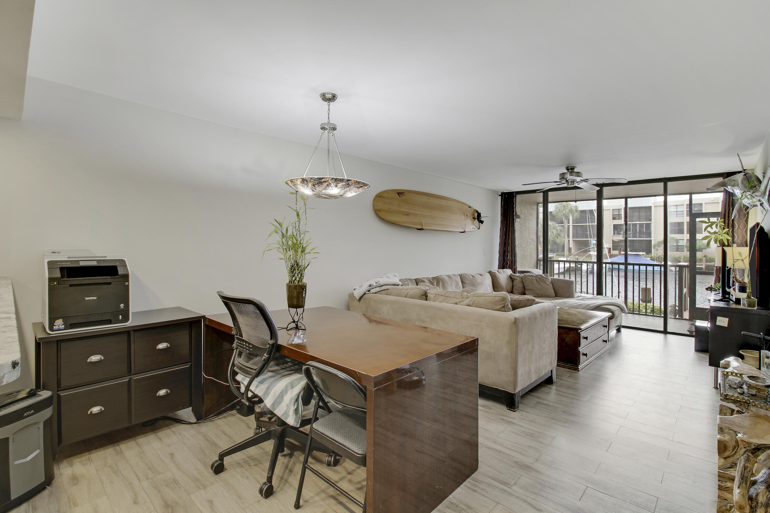 9 Royal Palm Way, Unit 105 Boca Raton, FL 33432 - Photo 7 of 26 a living room with furniture and a flat screen tv