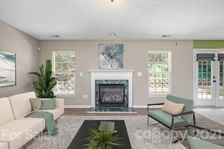 521 Red Oak Court Tega Cay, SC 29708 - Photo 2 of 23 a living room with furniture and a fireplace