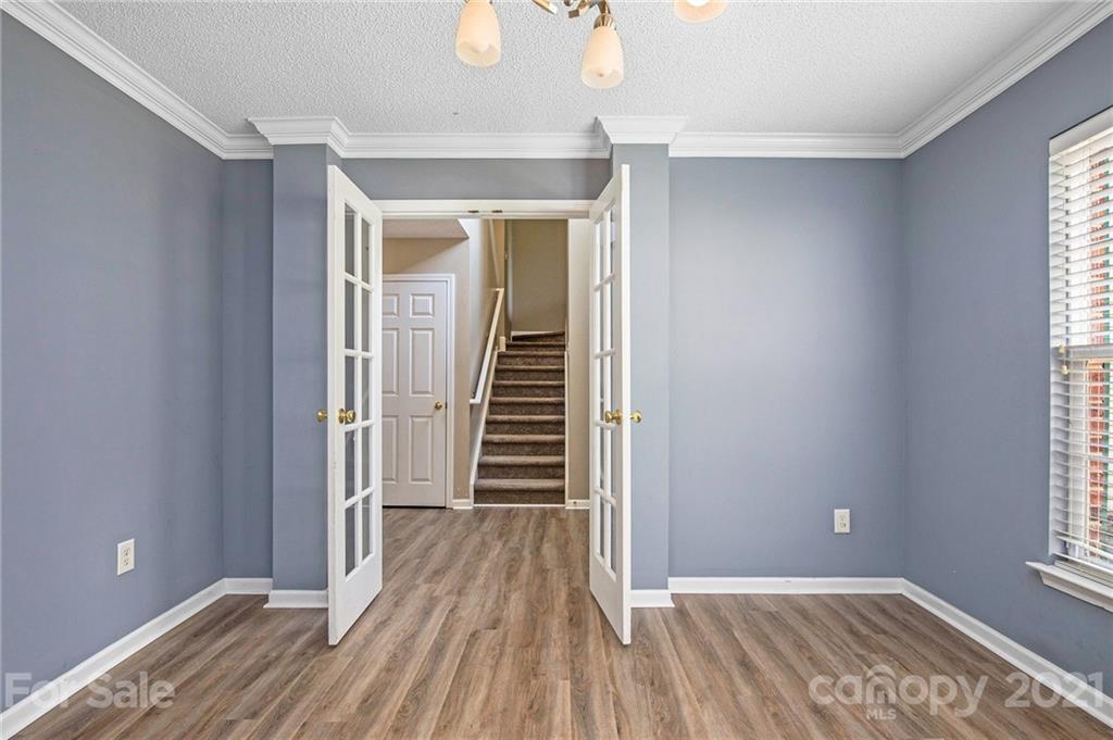 521 Red Oak Court Tega Cay, SC 29708 - Photo 14 of 23 a view of a room with wooden floor and staircase