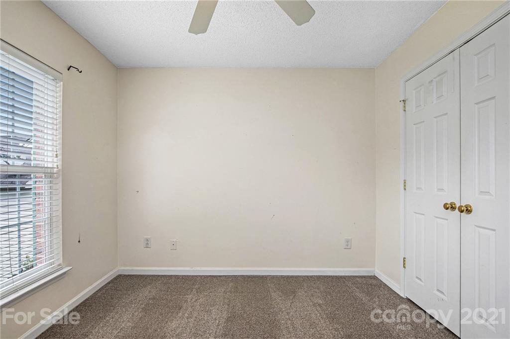 521 Red Oak Court Tega Cay, SC 29708 - Photo 19 of 23 an empty room with windows