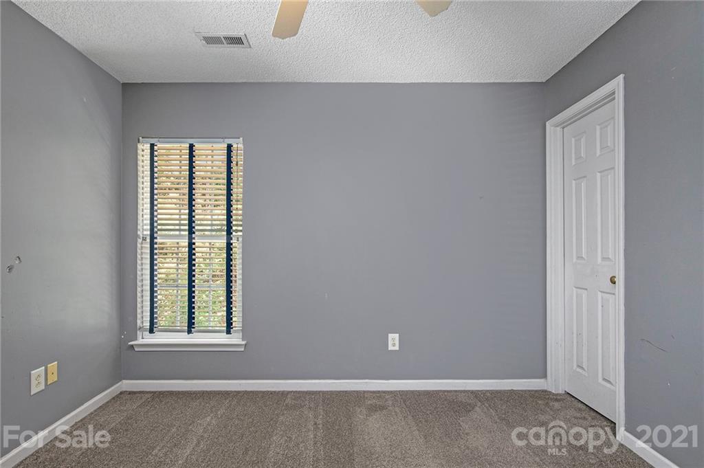 521 Red Oak Court Tega Cay, SC 29708 - Photo 21 of 23 a view of an empty room with a window