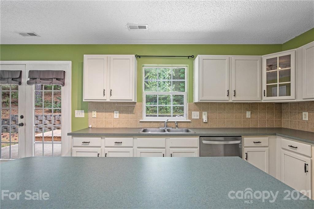 521 Red Oak Court Tega Cay, SC 29708 - Photo 8 of 23 a kitchen with a sink cabinets and window