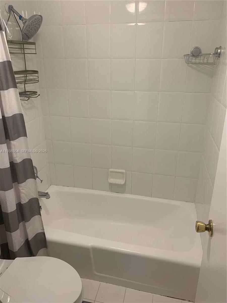 100 Lincoln Road, Unit 805 Miami Beach, FL 33139 - Photo 14 of 53 a bathroom with a bathtub and a toilet