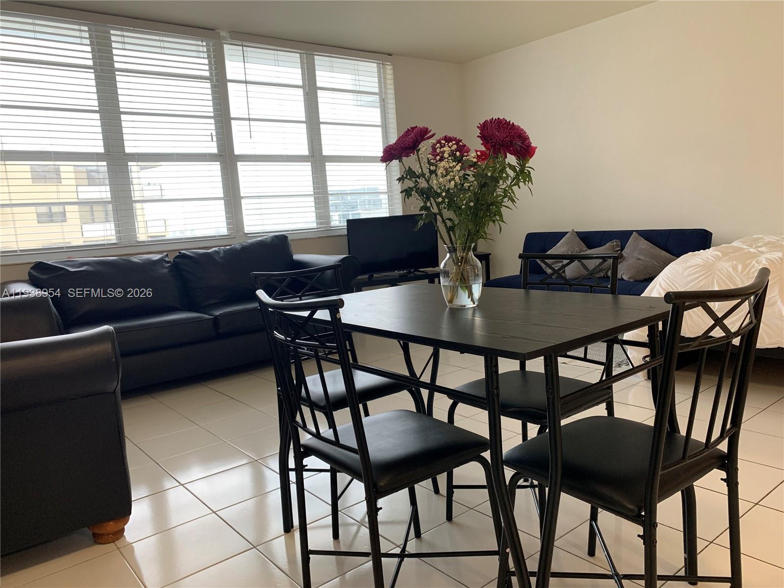 100 Lincoln Road, Unit 805 Miami Beach, FL 33139 - Photo 3 of 53 a view of a dining room with furniture and a potted plant