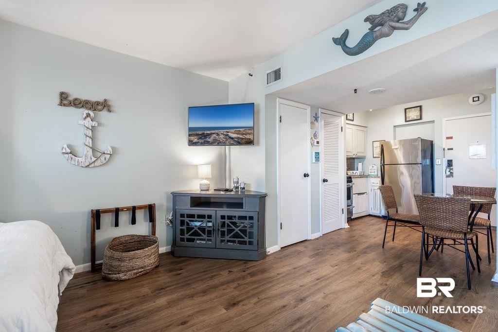 375 Plantation Road, Unit 5502 Gulf Shores, AL 36542 - Photo 6 of 27 The mounted television is conveniently located for you to view from the sofa or the comfortable queen bed.