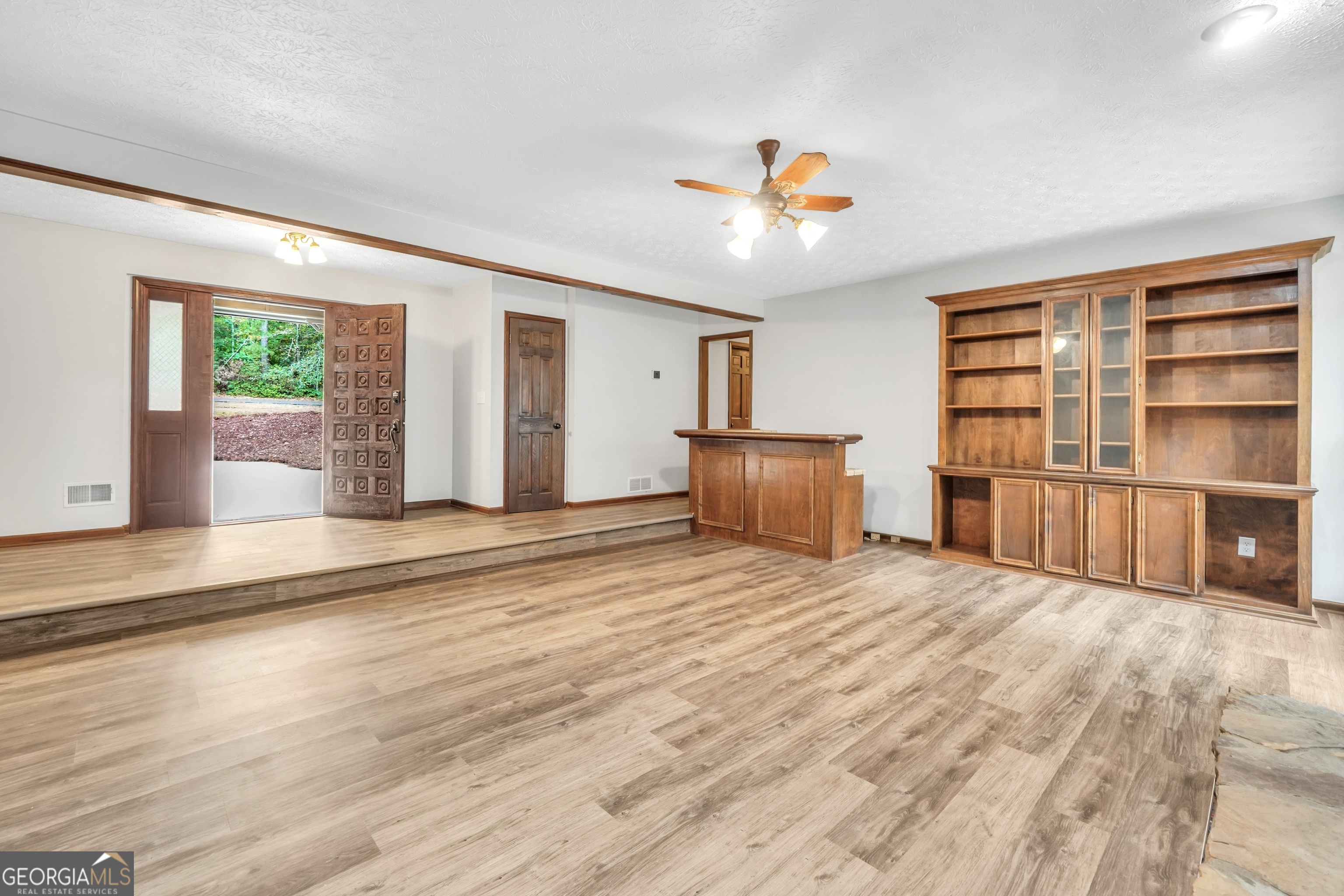 2103 Turner Church Road McDonough, GA 30252 - Photo 11 of 46 a view of empty room with wooden floor and fan