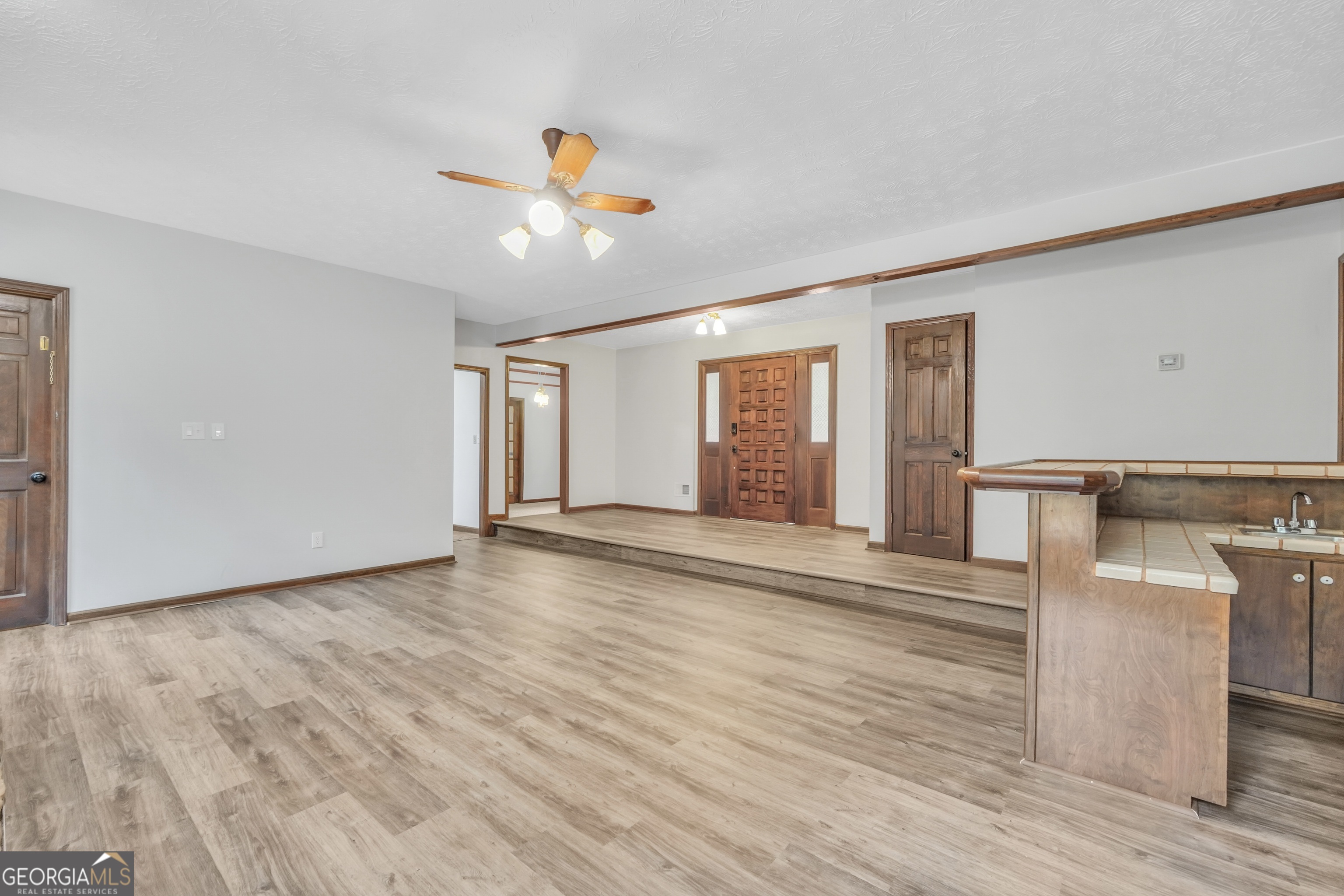 2103 Turner Church Road McDonough, GA 30252 - Photo 13 of 46 a view of an empty room with wooden floor and a window
