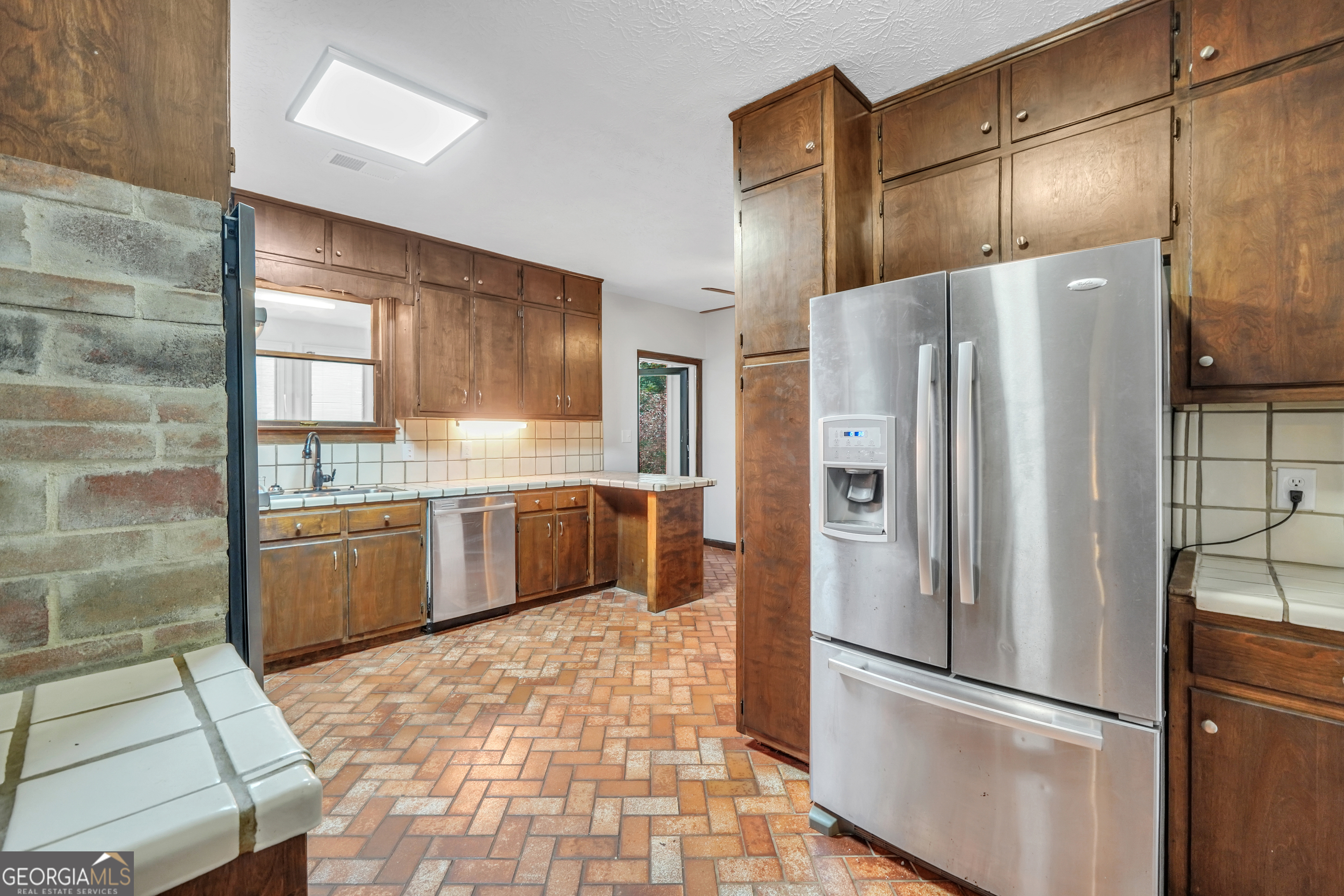 2103 Turner Church Road McDonough, GA 30252 - Photo 17 of 46 a kitchen with granite countertop a refrigerator and a sink