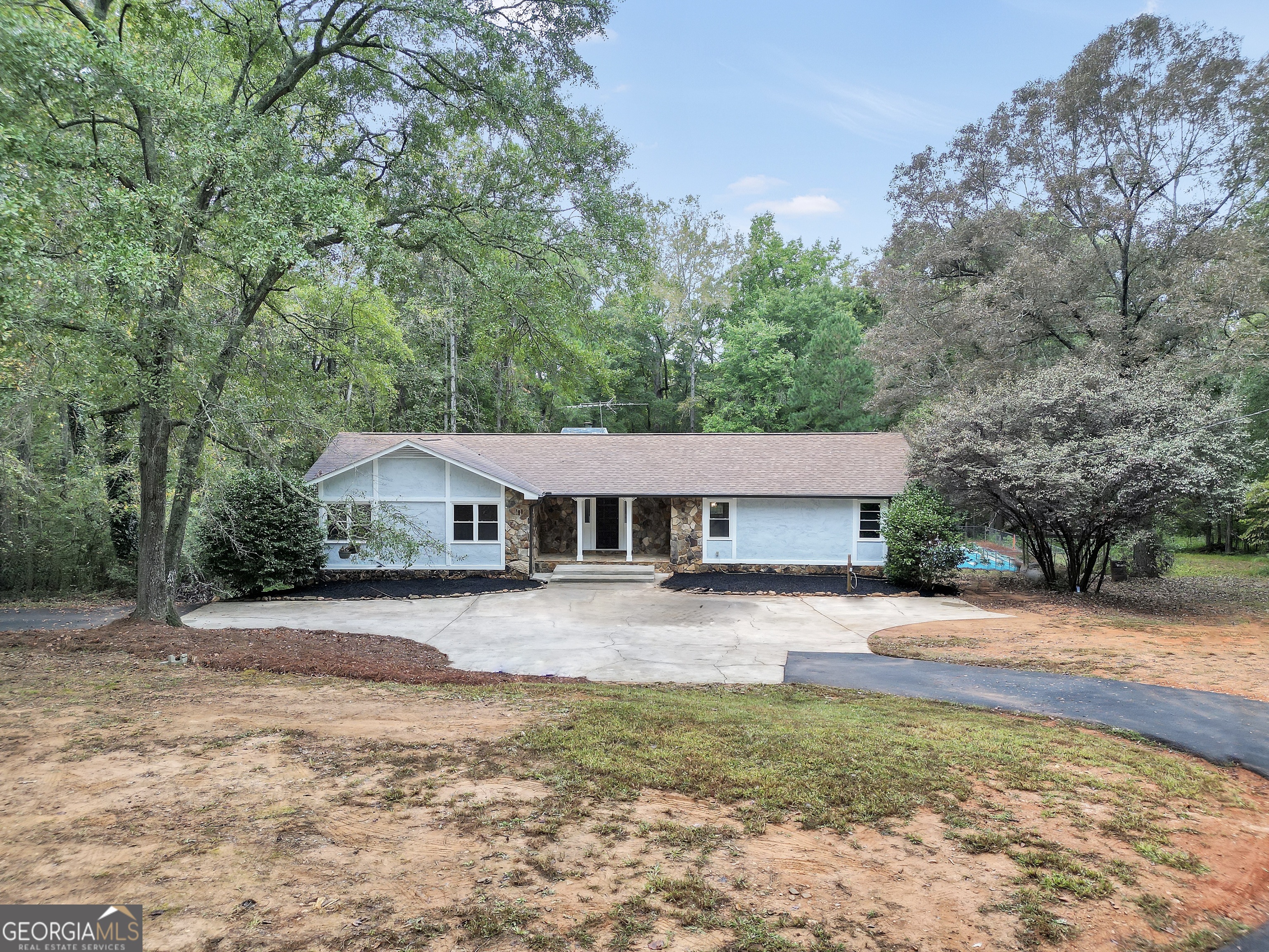 2103 Turner Church Road McDonough, GA 30252 - Photo 2 of 46 a front view of a house with a yard and trees