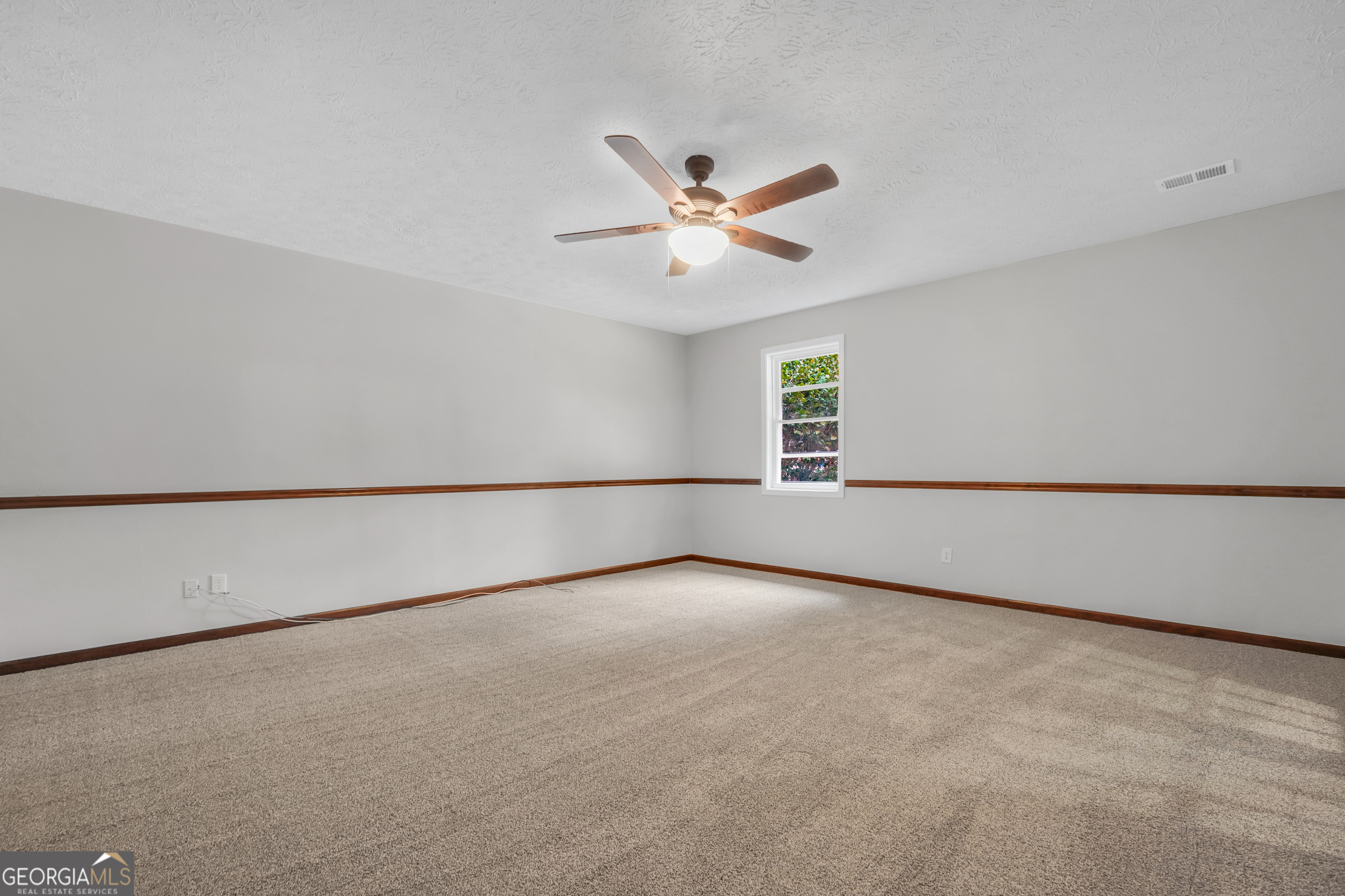 2103 Turner Church Road McDonough, GA 30252 - Photo 21 of 46 an empty room with a empty space and a ceiling fan