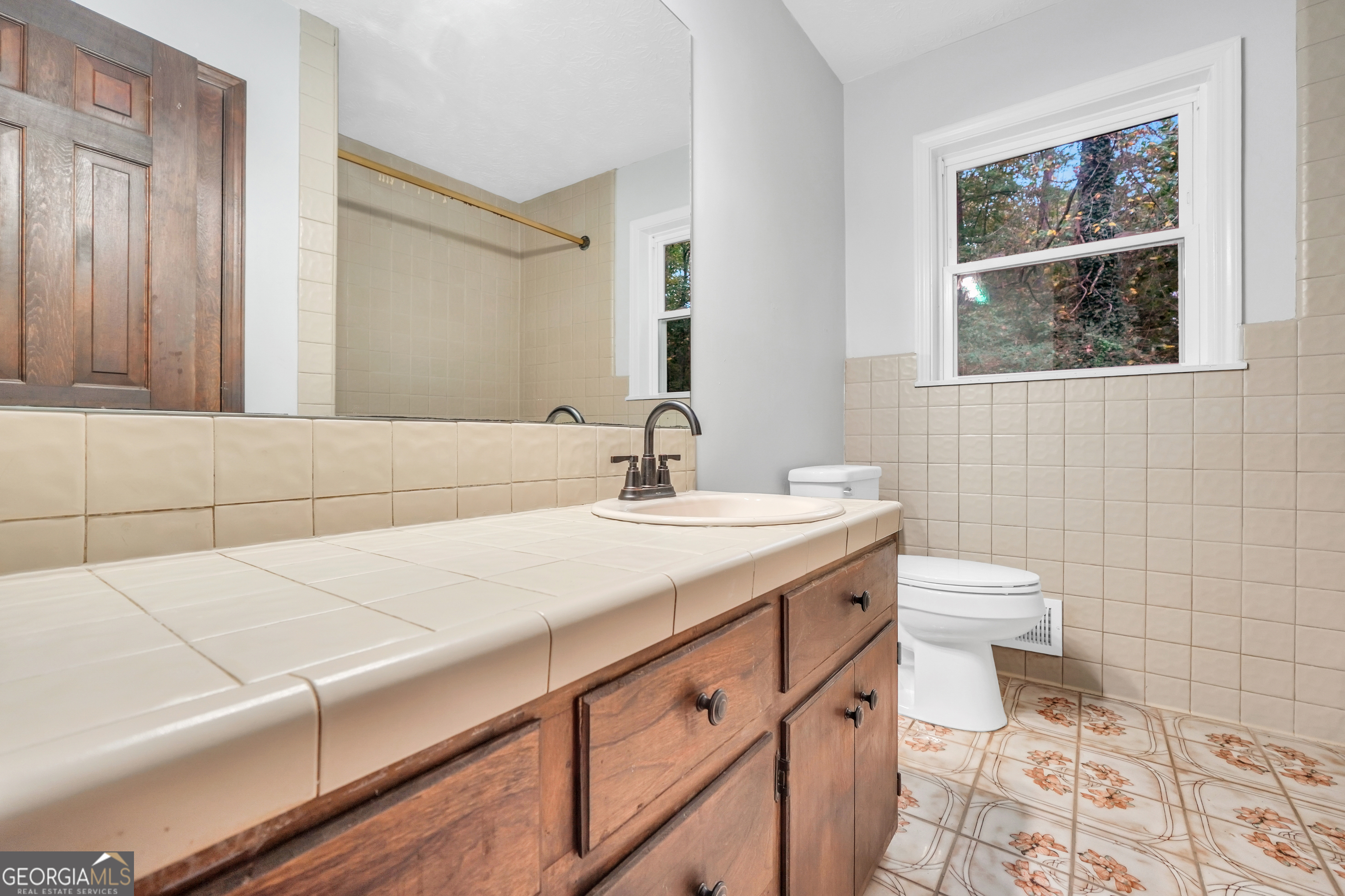 2103 Turner Church Road McDonough, GA 30252 - Photo 26 of 46 a bathroom with a sink a toilet and mirror