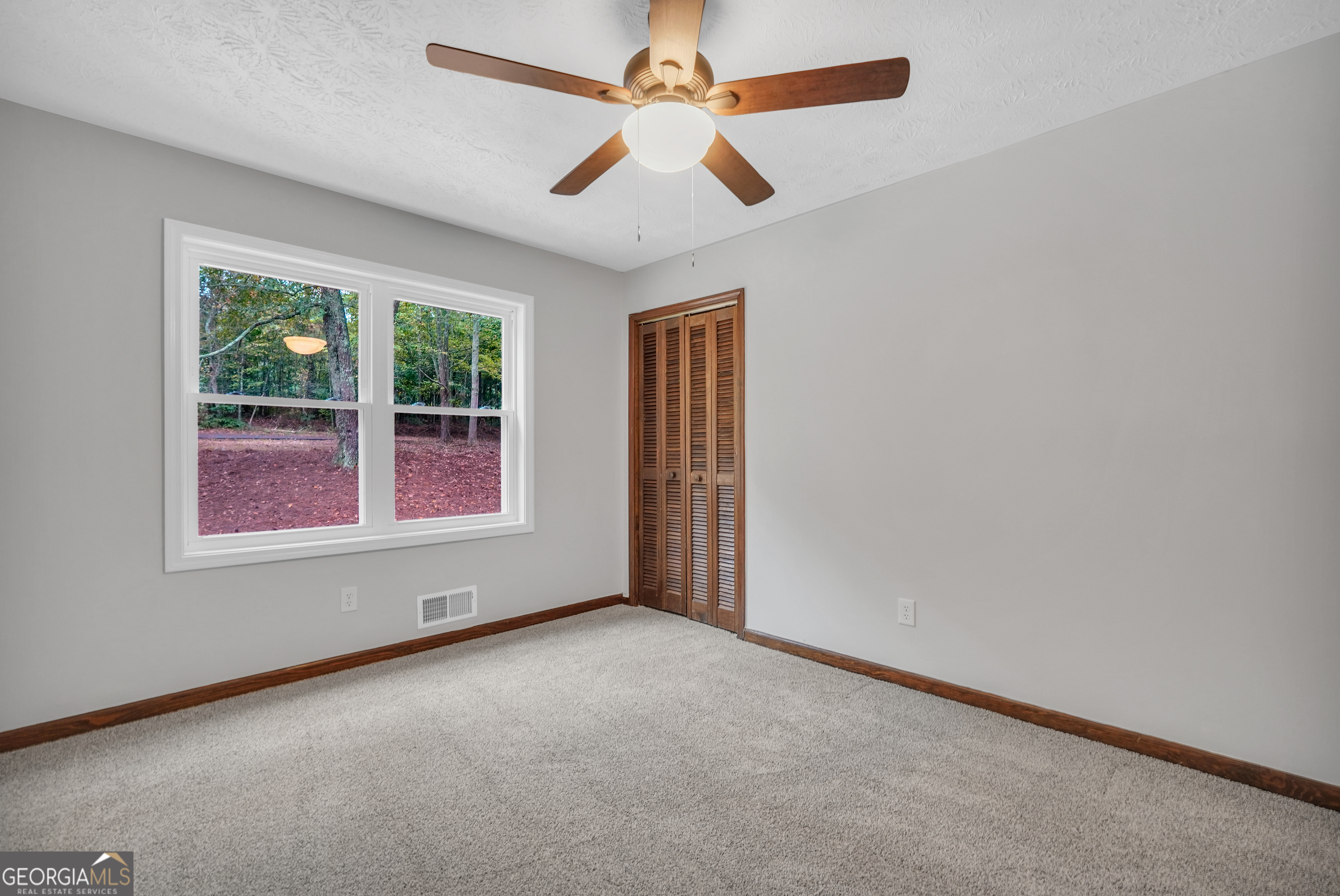 2103 Turner Church Road McDonough, GA 30252 - Photo 31 of 46 an empty room with windows and fan