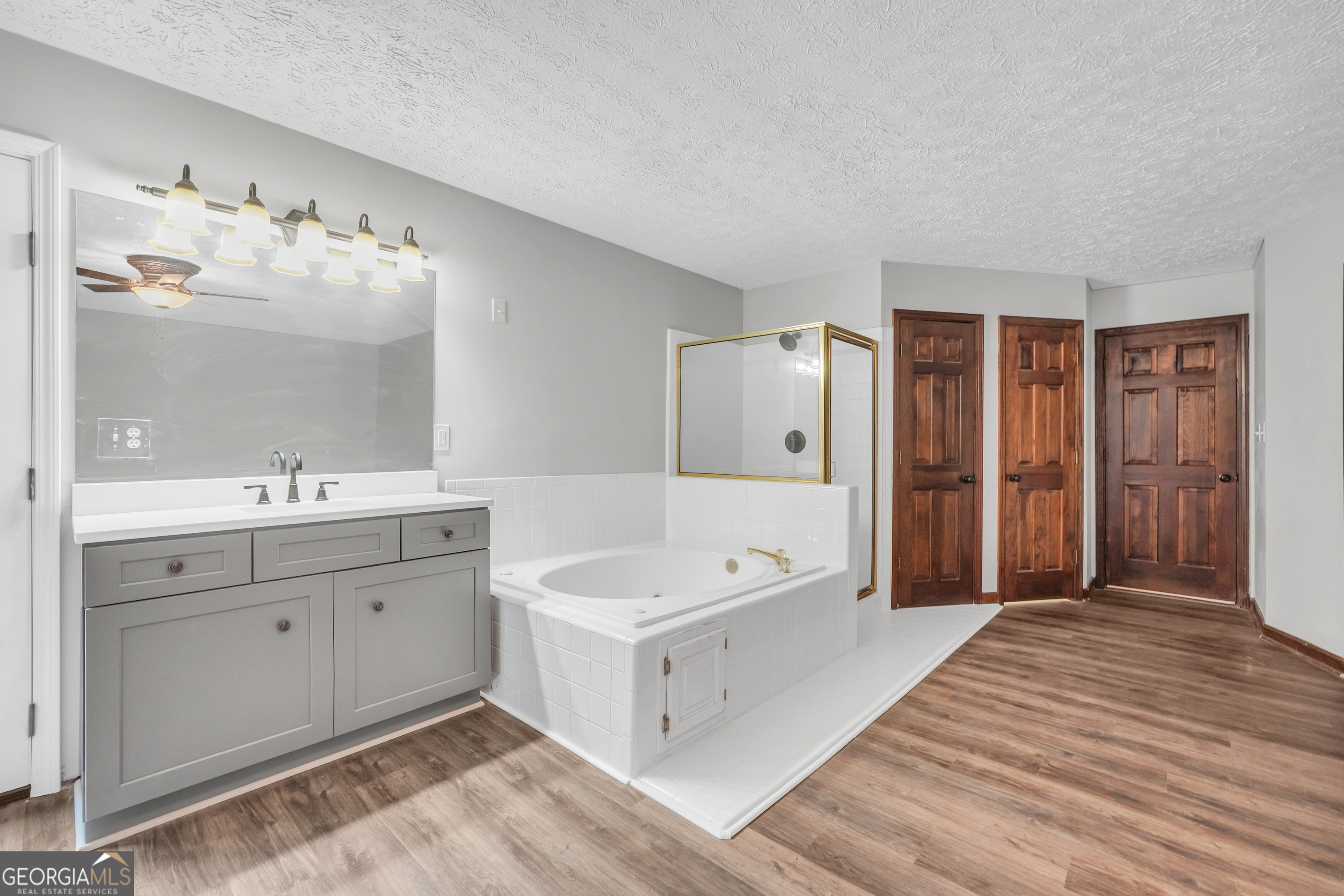 2103 Turner Church Road McDonough, GA 30252 - Photo 34 of 46 a spacious bathroom with a double vanity sink a mirror and a bathtub