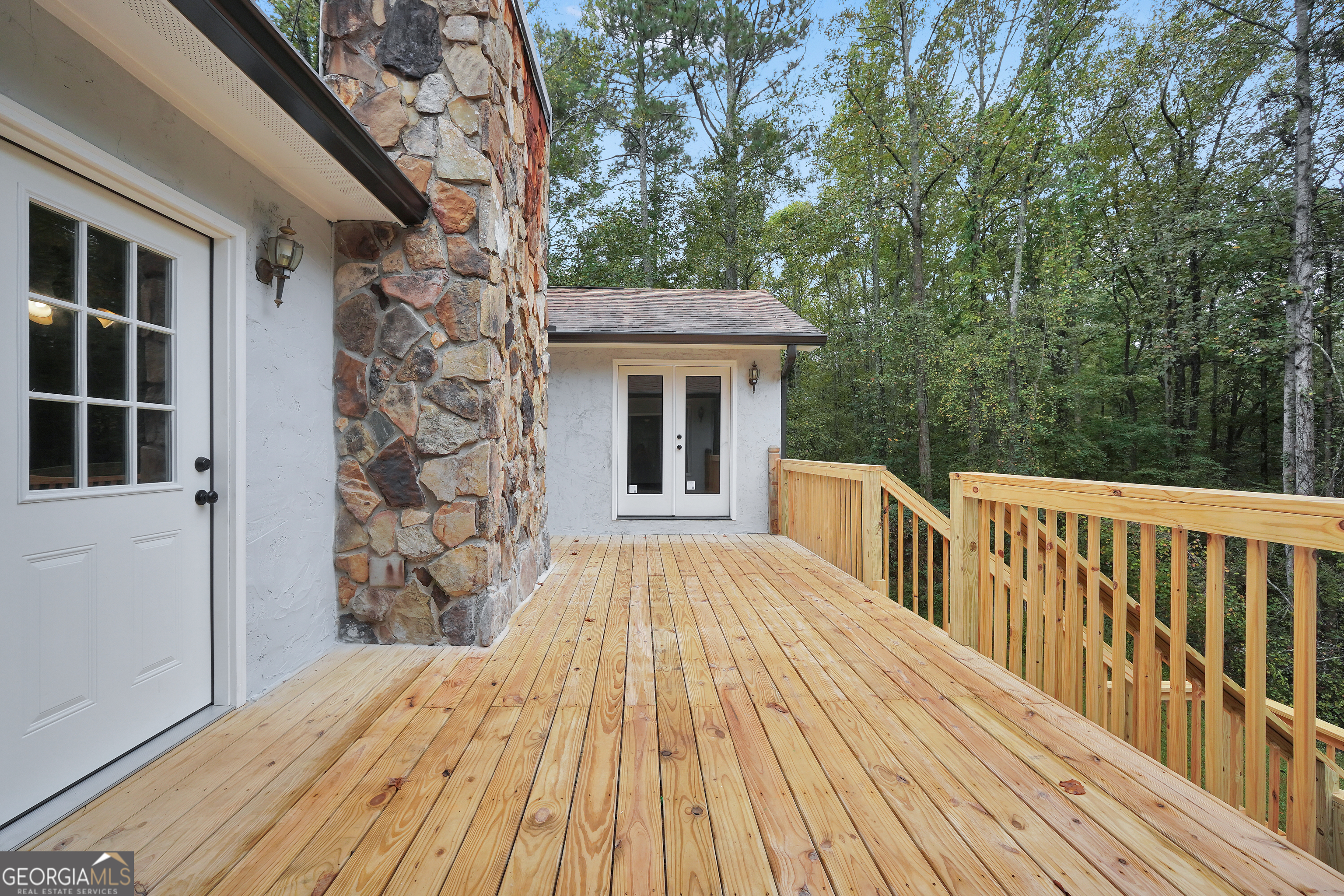 2103 Turner Church Road McDonough, GA 30252 - Photo 38 of 46 a balcony with wooden floor and fence