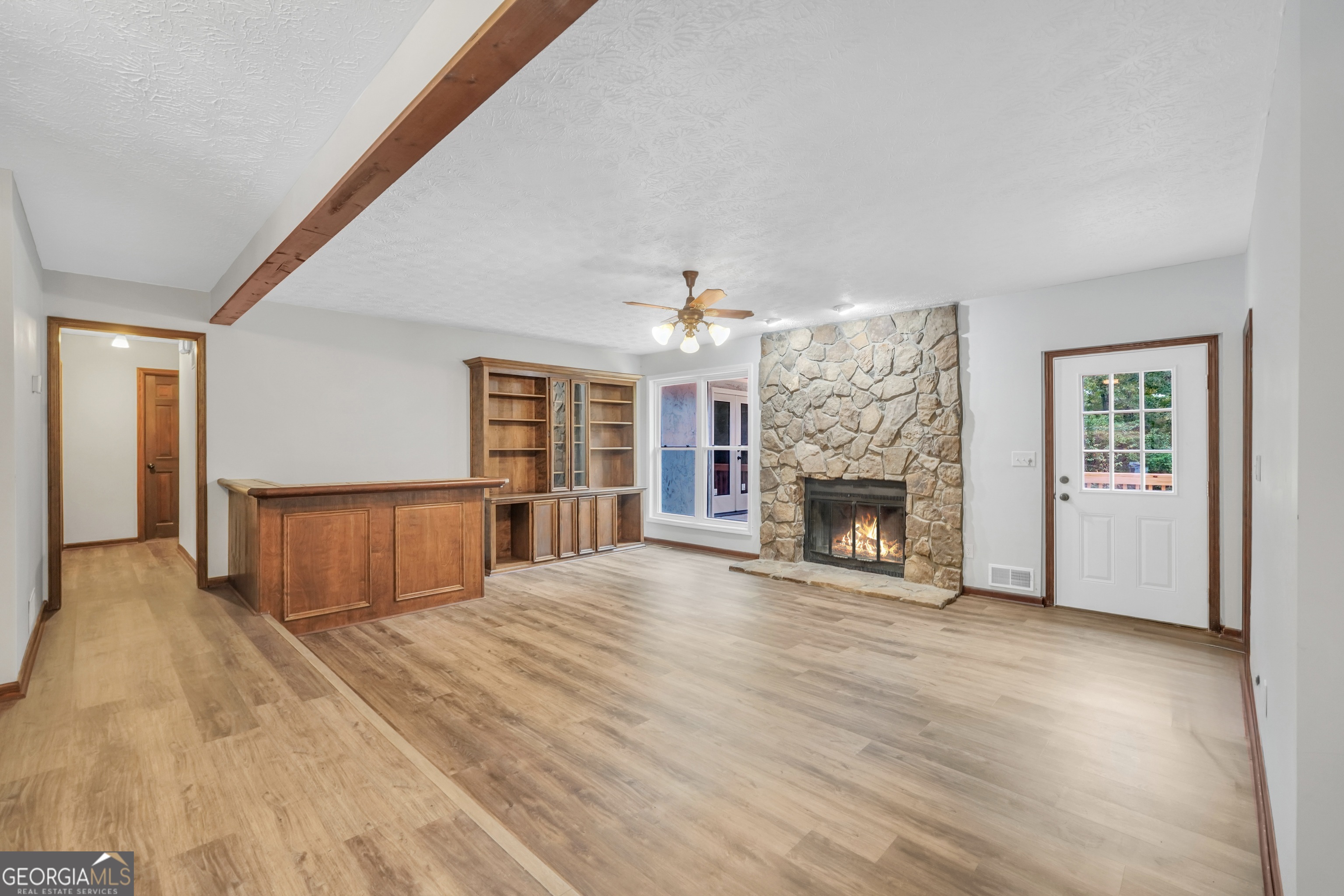 2103 Turner Church Road McDonough, GA 30252 - Photo 8 of 46 a spacious bedroom with a bed and a fireplace