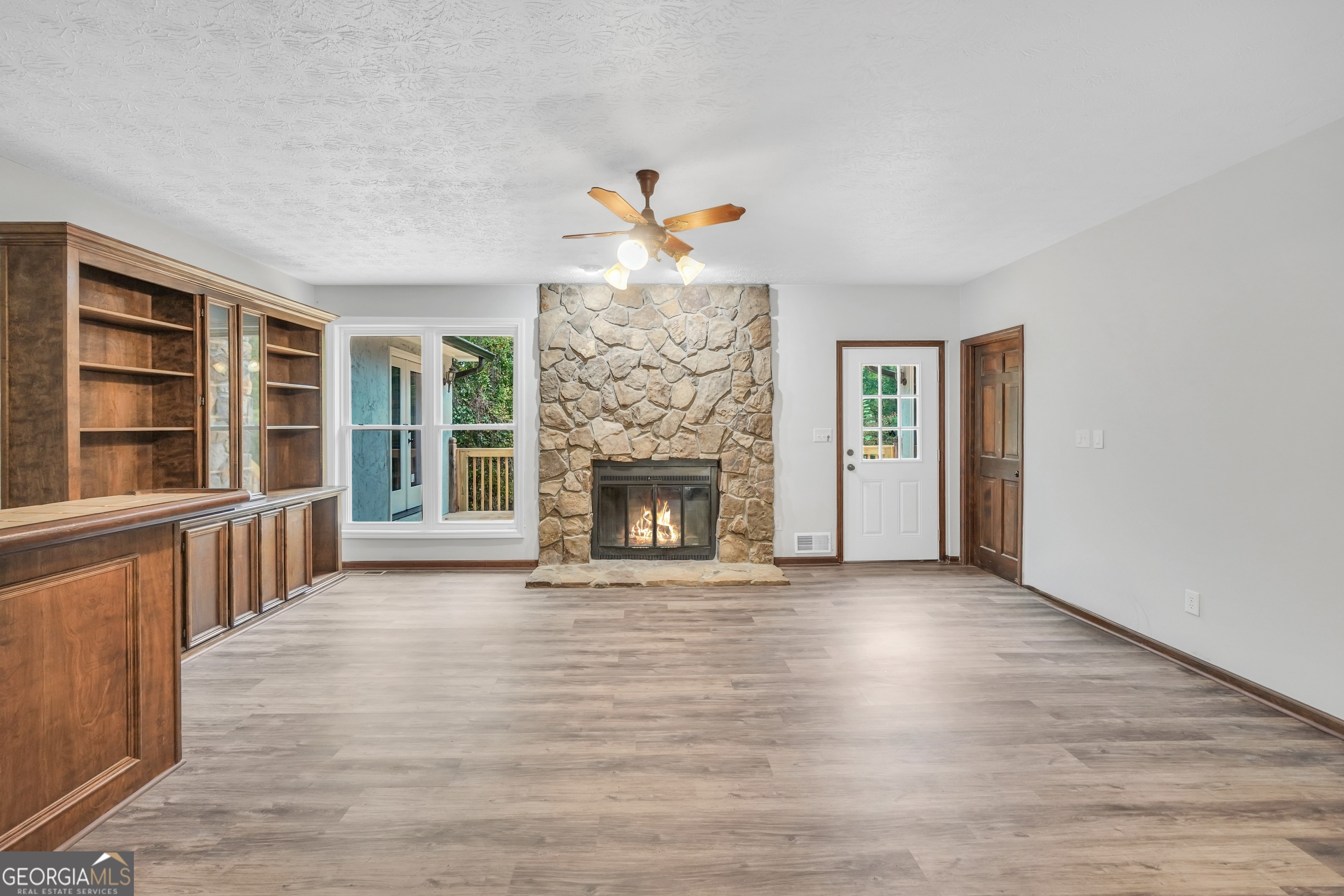 2103 Turner Church Road McDonough, GA 30252 - Photo 9 of 46 wooden floor in an empty room with a fireplace