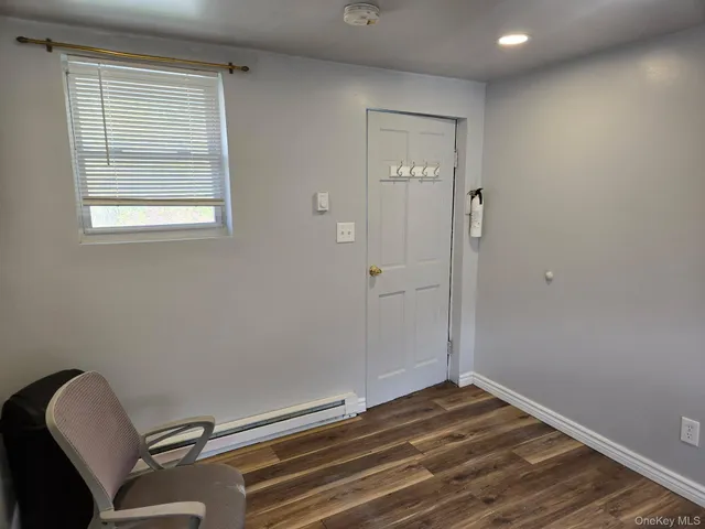 a room with a chair and a window