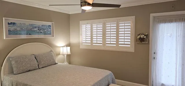 a bedroom with a bed and wall painting