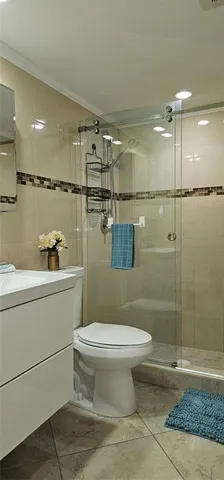 a bathroom with a shower and a shower