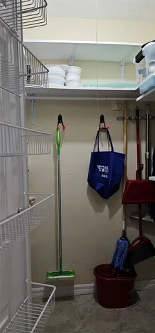 a living room with furniture and a mirror