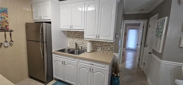 a view of a dining room with furniture and window